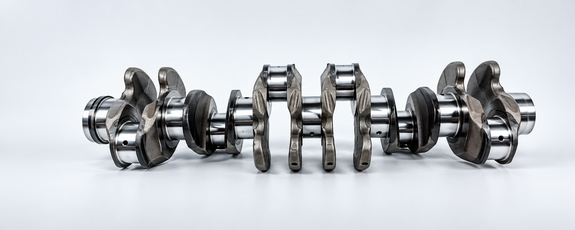 Horizontal crankshaft with polished journals, counterweights and visible oil holes