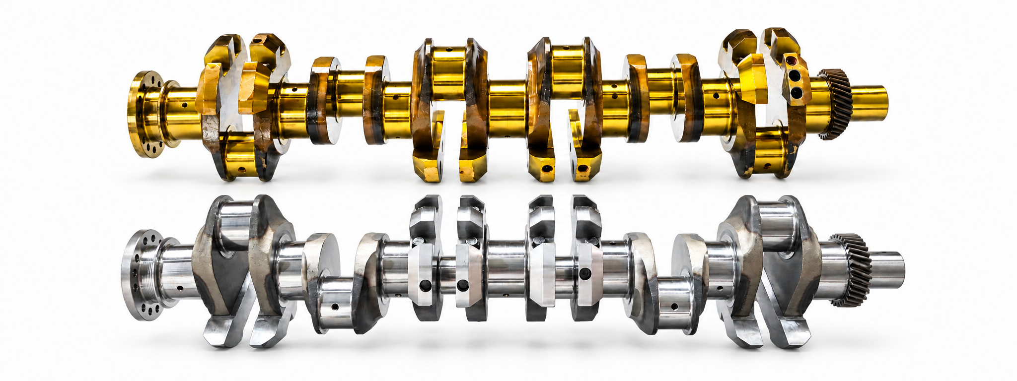 Gold and silver crankshafts on a light background