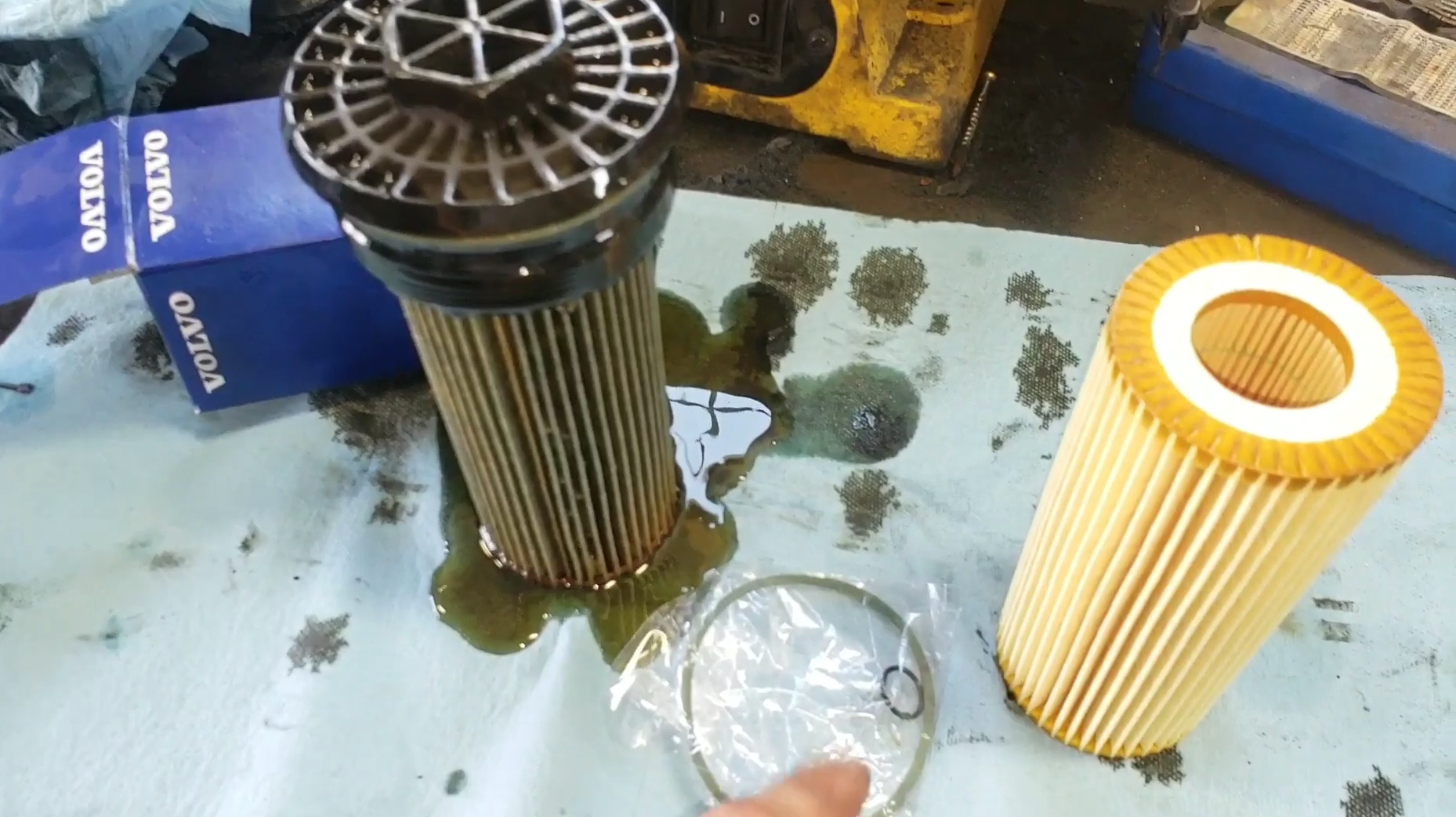 Technician performing Volvo transmission fluid analysis for preventive maintenance