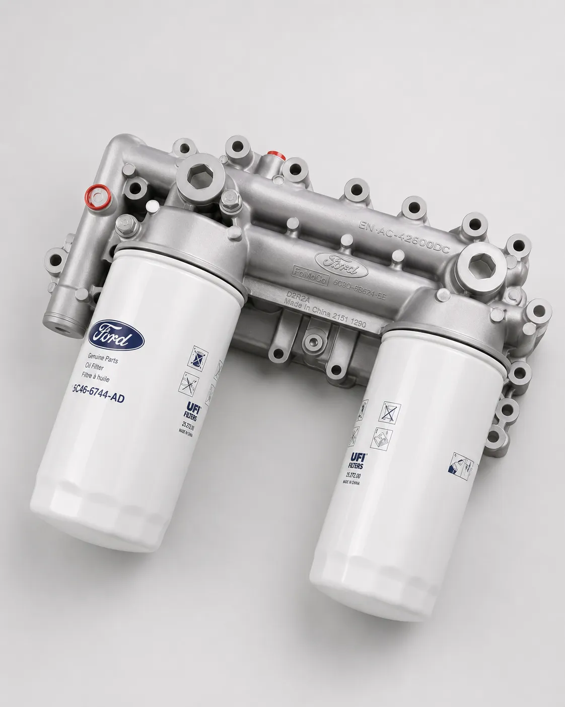 Ford engine dual oil filter housing assembly for heavy duty diesel filtration system